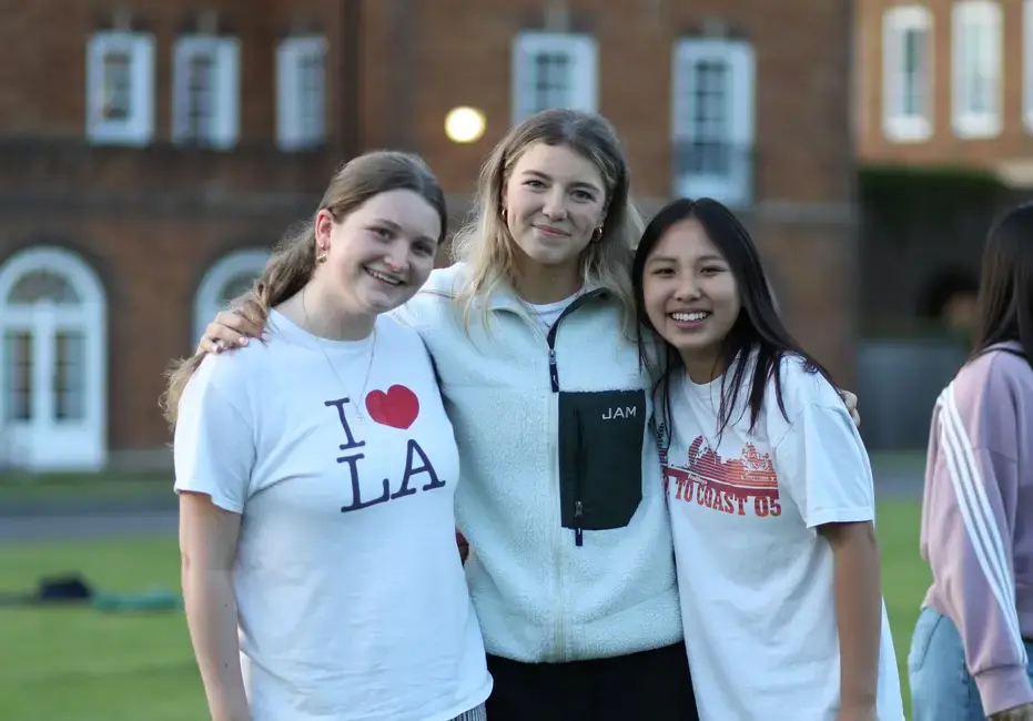 St Swithun's school boarders enjoying a moment together on the front field