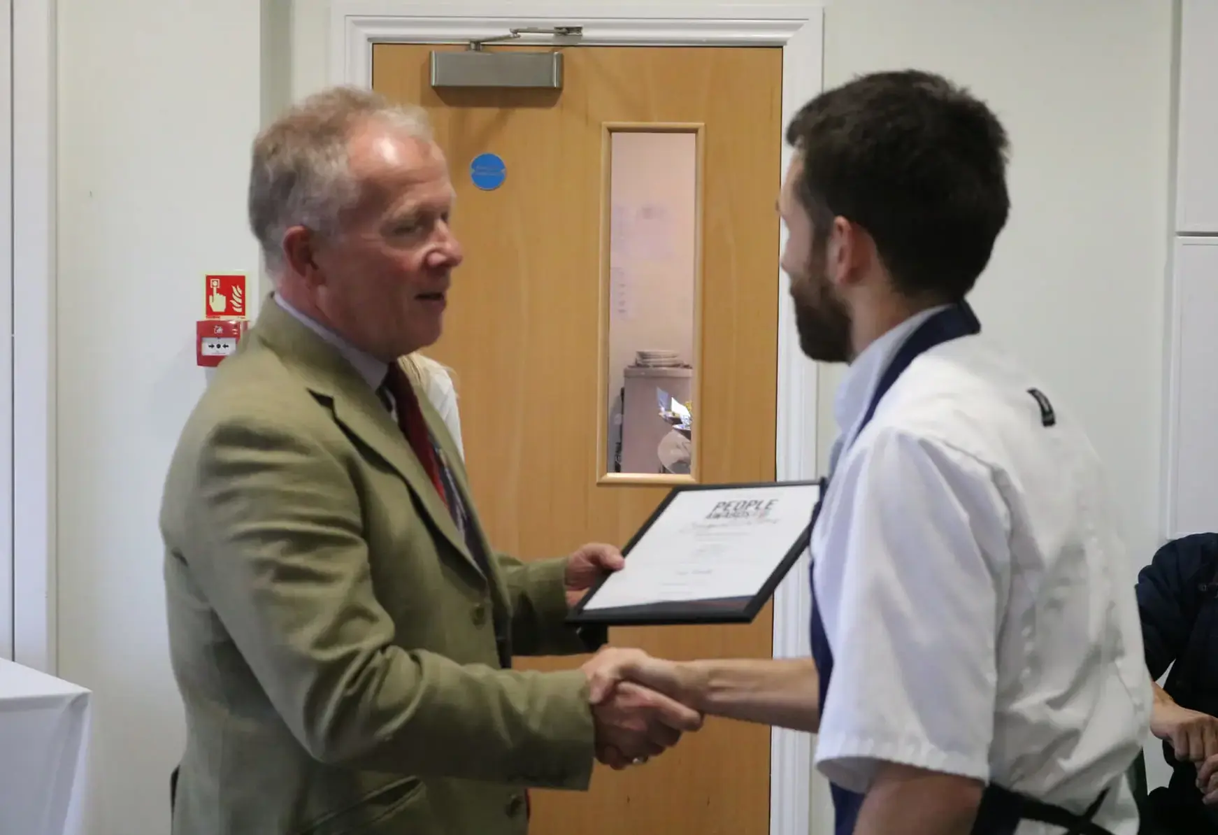 Award winning Chef at St Swithun's private school for girls in Hampshire handshake with certificate