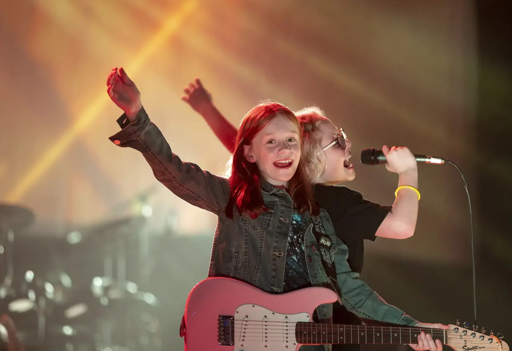 girls singing on stage at St Swithun's private school for girls in Hampshire