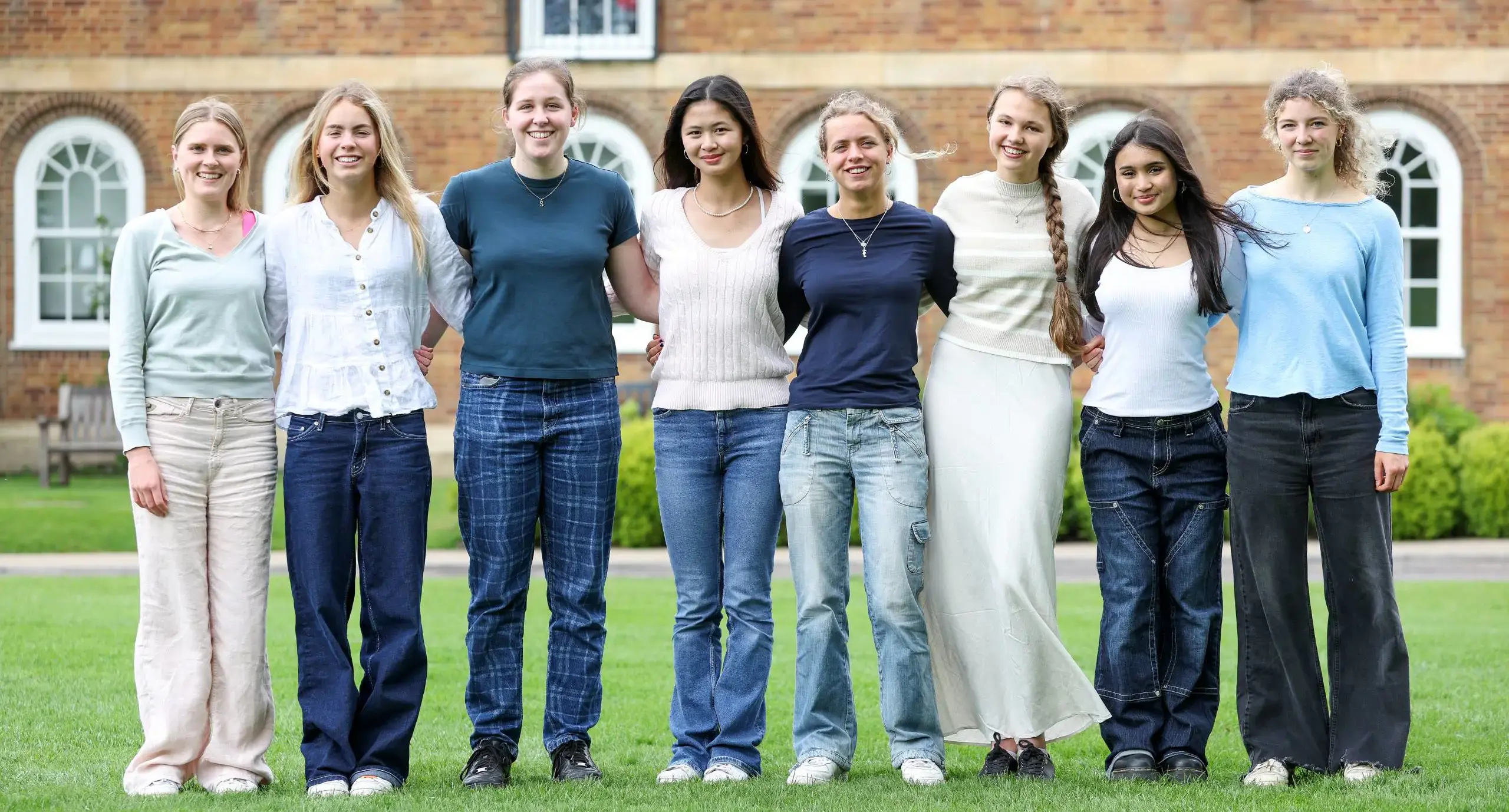 Sixth formers standing on a field