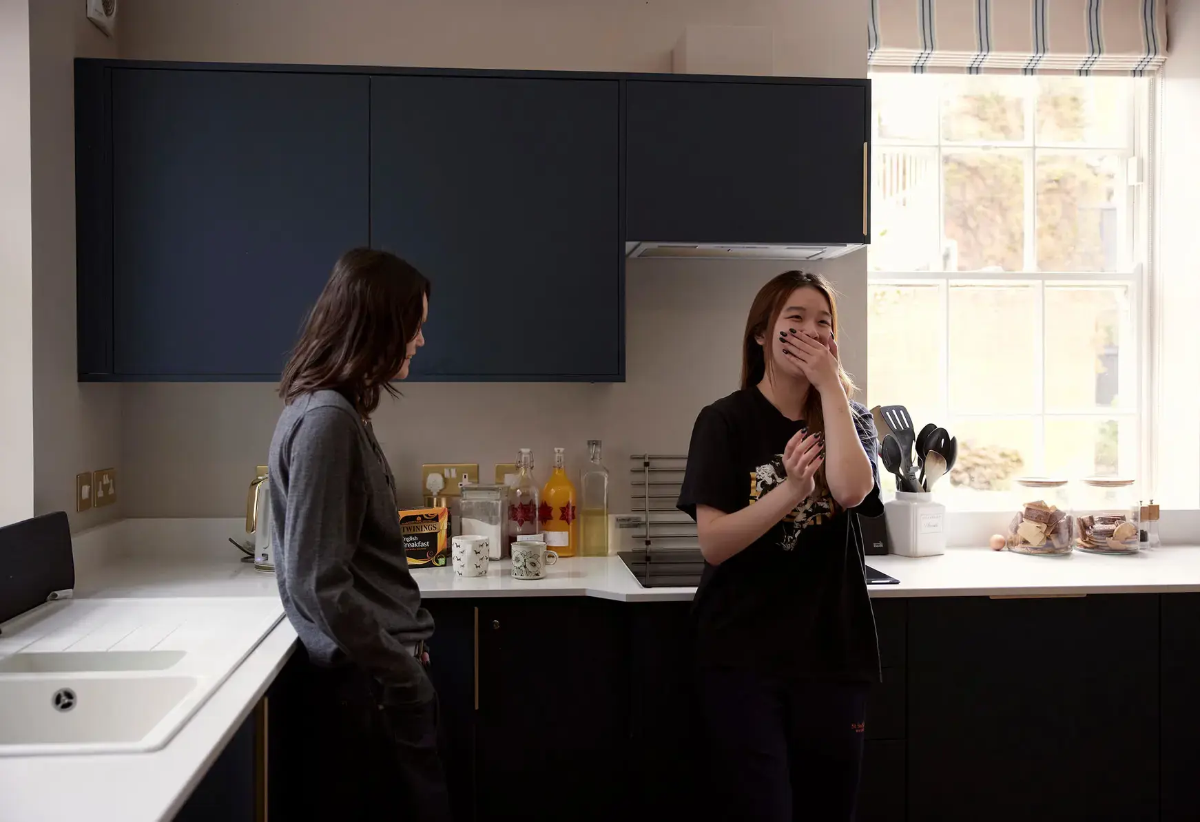Sixth form students at St Swithun's School for girls in Hampshire outstanding A-level results Sixth form students at St Swithun's School for girls in Hampshire in a kitchen laughing