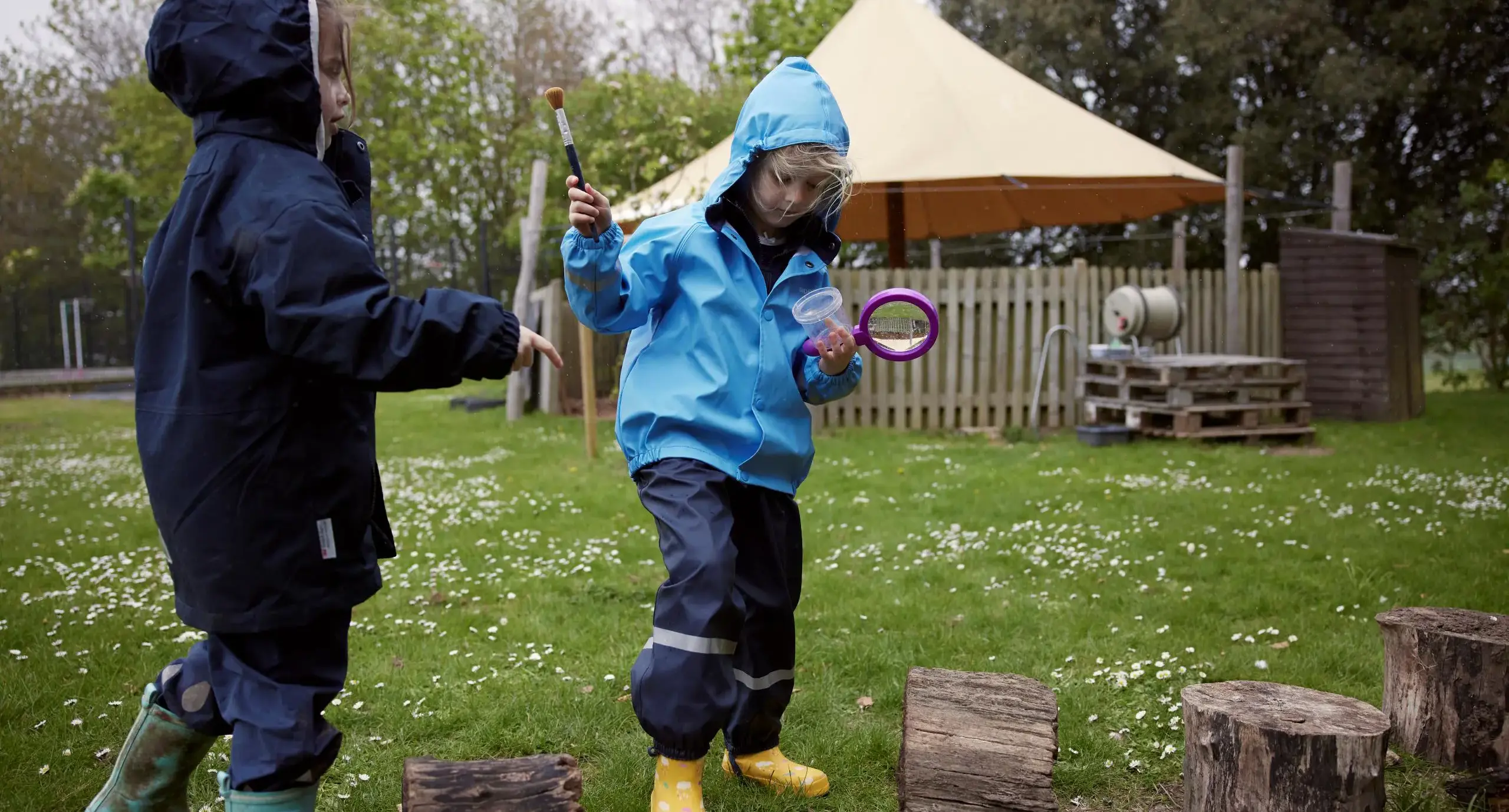 Prep school students blowing bubbles outdoors