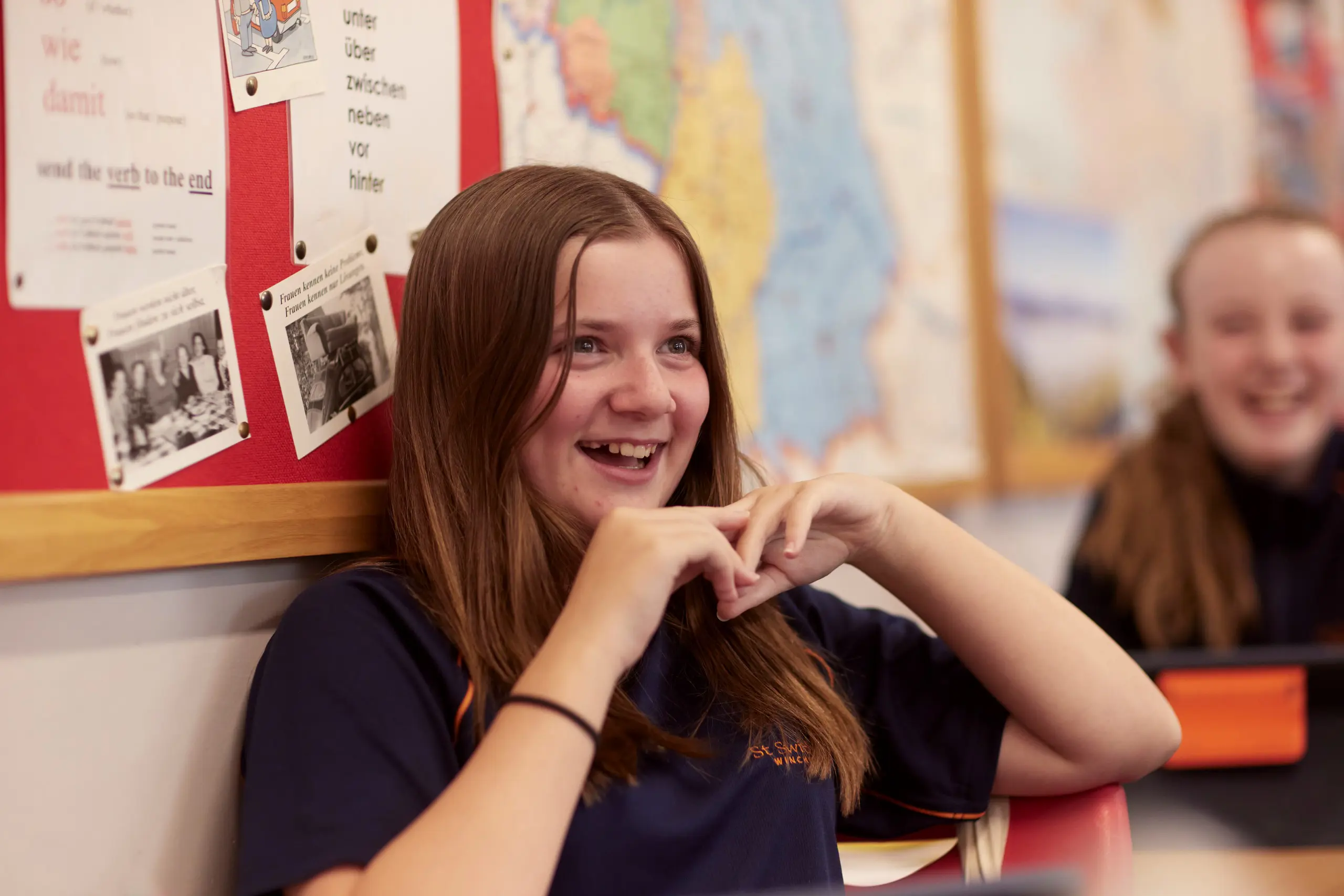 Girl smiling in lesson at St Swithun's School, an independent school in Winchester in Hampshire