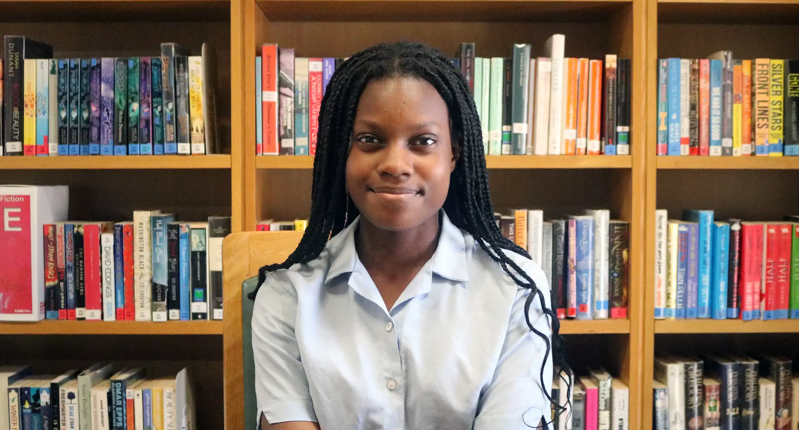 Private girls school student in library for award