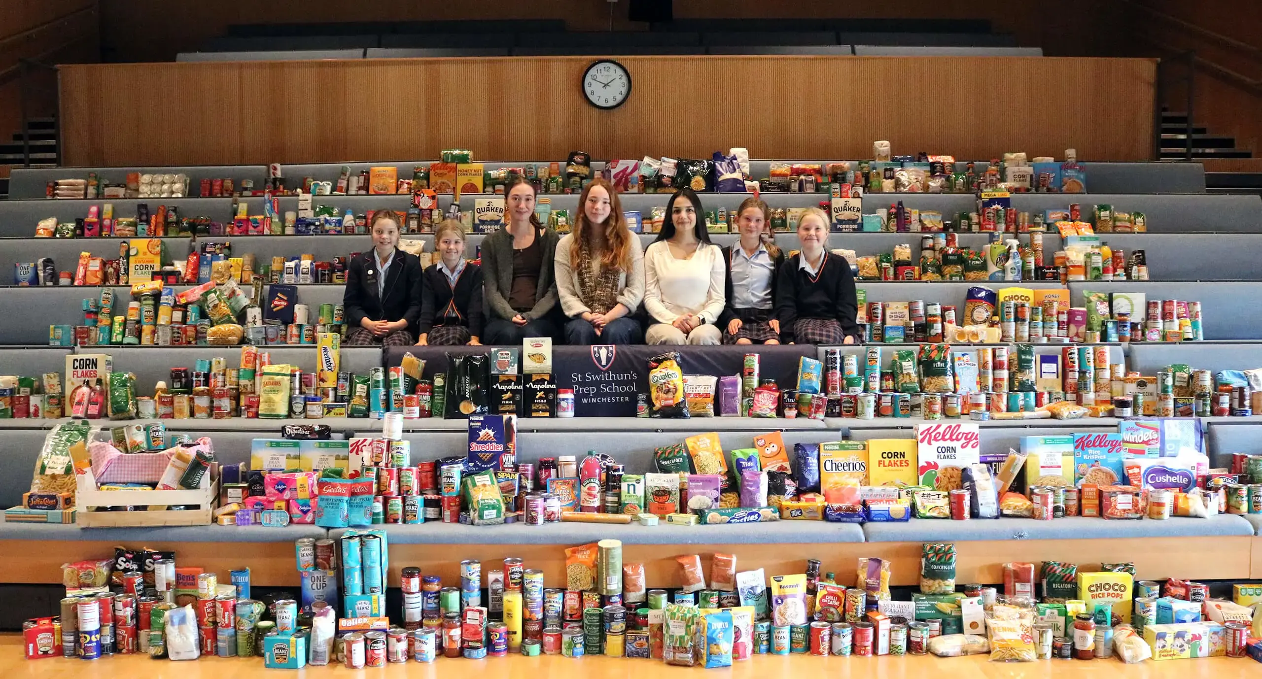 Student at St Swithun's private School for girls in Winchester donating to food bank community service