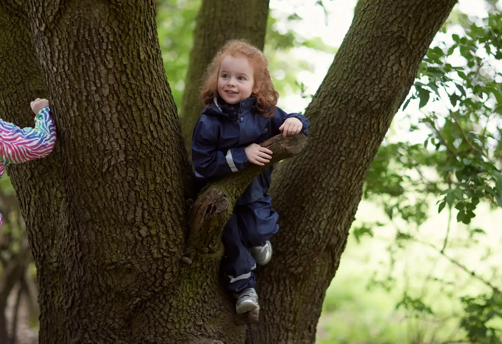 Young students outside learning in the forest at St Swithun's School for girls in Hampshire 
