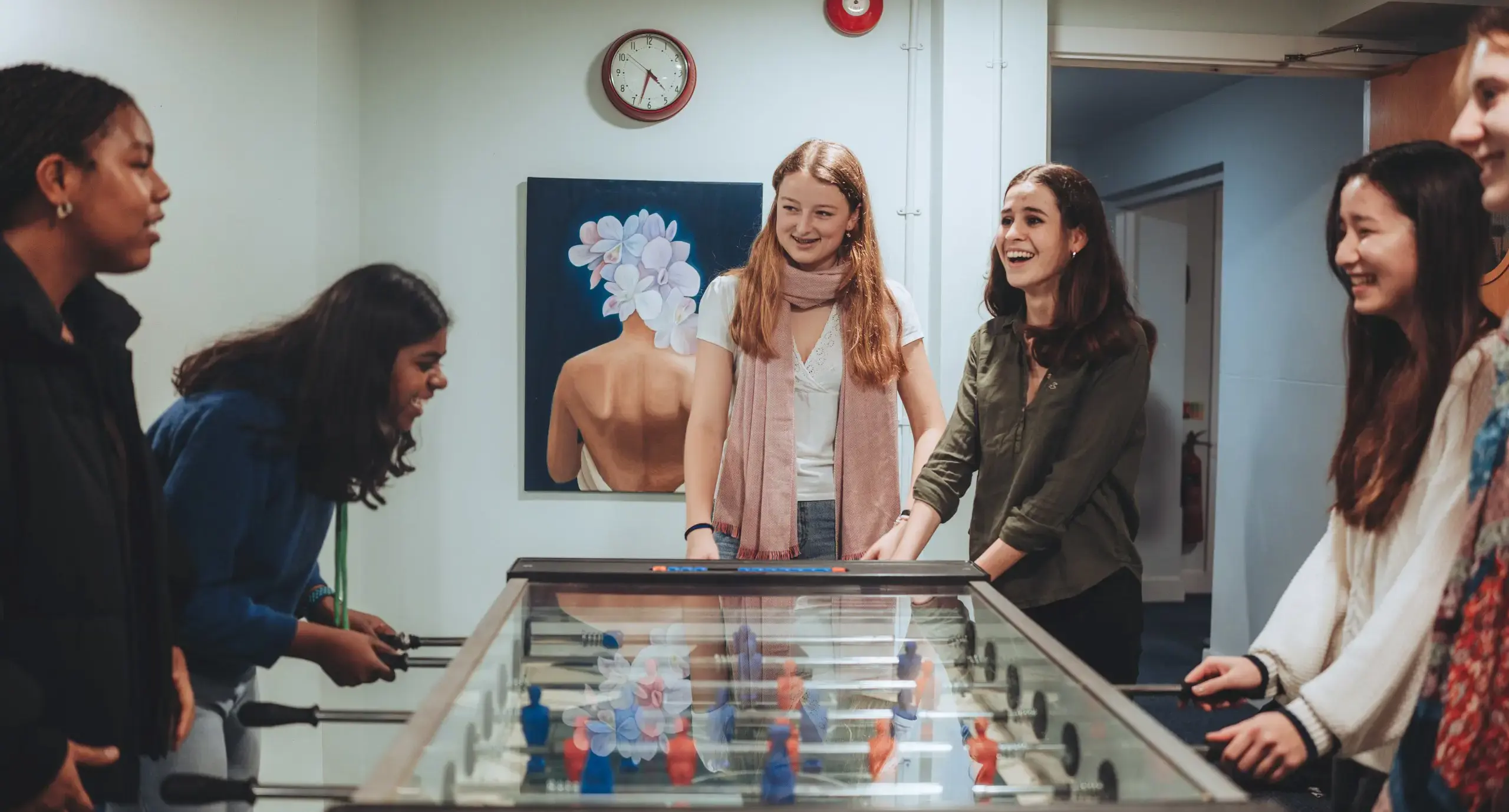 Students playing foosball